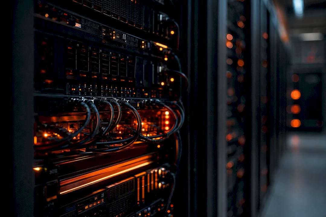 Data center aisle with server racks and orange lighting